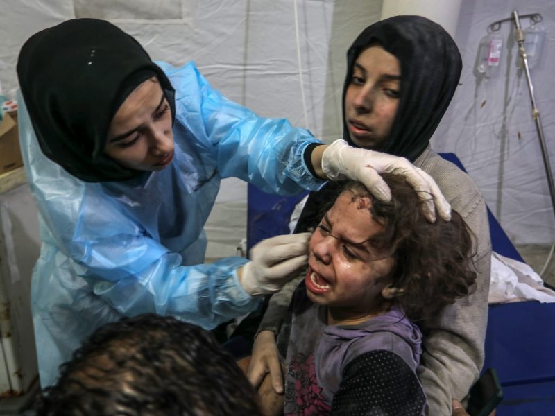 An injured Palestinian child receives treatment at Al-Najjar Hospital after an Israeli air strike on the home of the Qeshta family. Photo by Abed Rahim Khatib/picture alliance via Getty Images