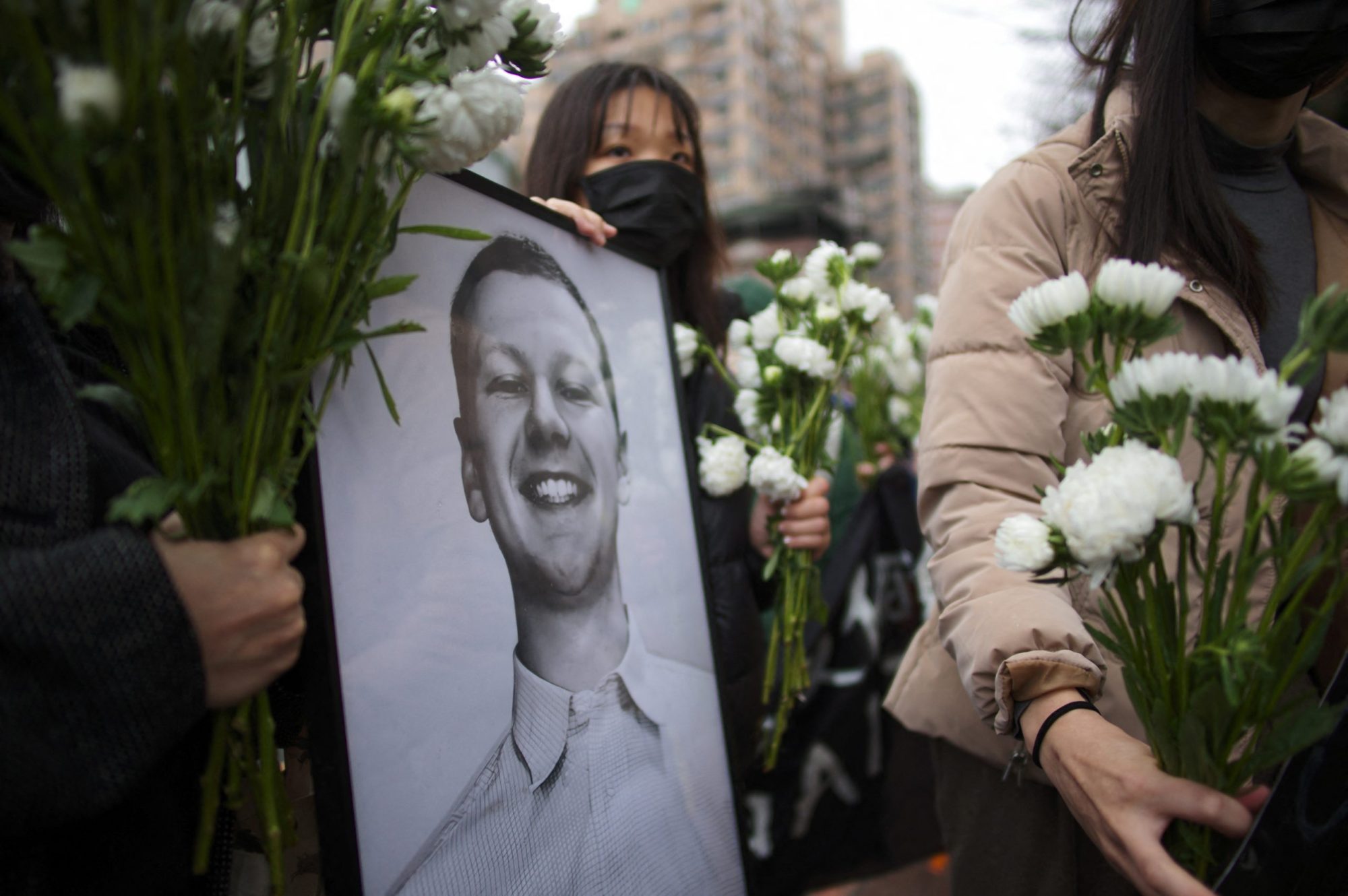 Demonstrators from the Taiwan Action Front for Palestine display a portrait of Aaron Bushnell, a 25-year-old active duty member of the US Air Force who setting himself on fire outside the Israel Embassy in Washington, during a protest against US's policies to Israel and Palestine, outside the American Institute in Taiwan (AIT) in Taipei on March 7, 2024. (Photo by SAM YEH/AFP via Getty Images)