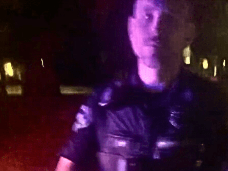 Bellingam, WA Police confront driver for alleged traffic violations. Photo- Cell phone image courtesy of Andrew Stean